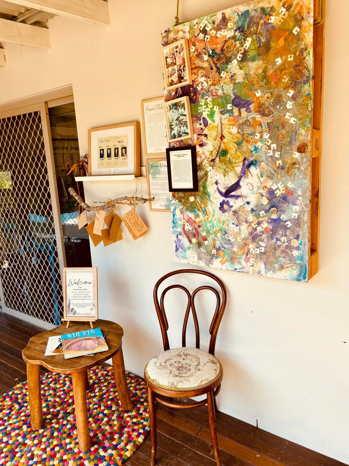 Children's salon-style art wall in the indoor studio at Natural Elements Merrimac