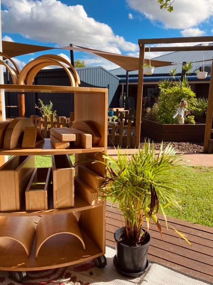 Hand-built wooden archway entrance into the natural play space